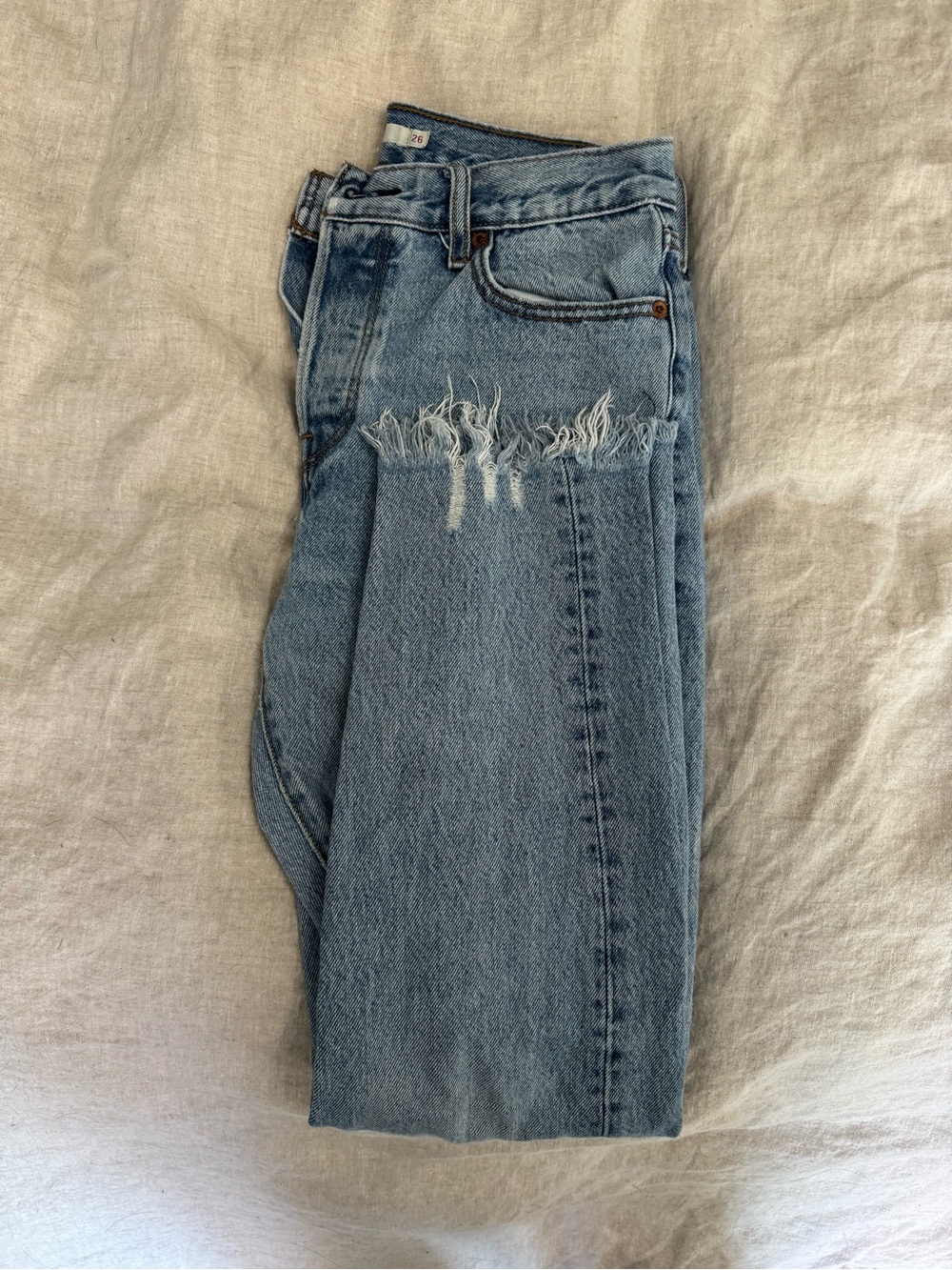 Levi's Women's Straight Leg Jeans in Light Blue with Distressed Knee